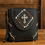 Black handbag with decorative elements on a wooden surface and background